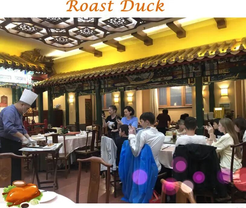 Students enjoying Peking duck dinner during Beijing school trip